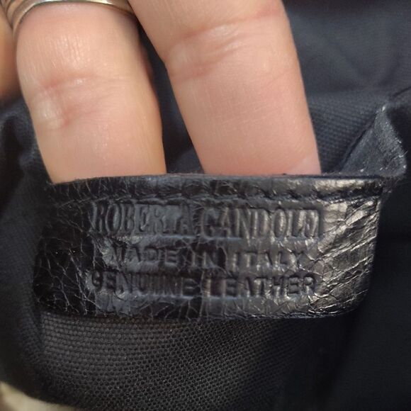 Brown and Black Shoulder Bag with Durable Fabric and Decorative Tassels - Picture 2 of 6